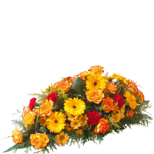 Raquette de fleurs naturelles composées dans des tons chaleureux